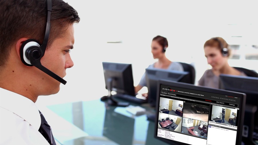 A group of people monitoring security systems.