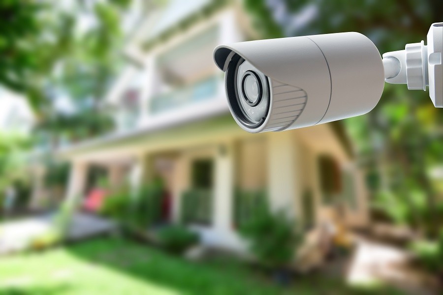 Video surveillance camera looking over the property of a luxury home.